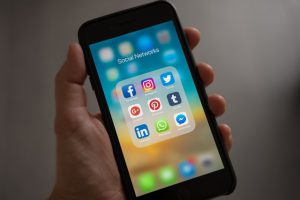 a phone showing options for paid social media advertising